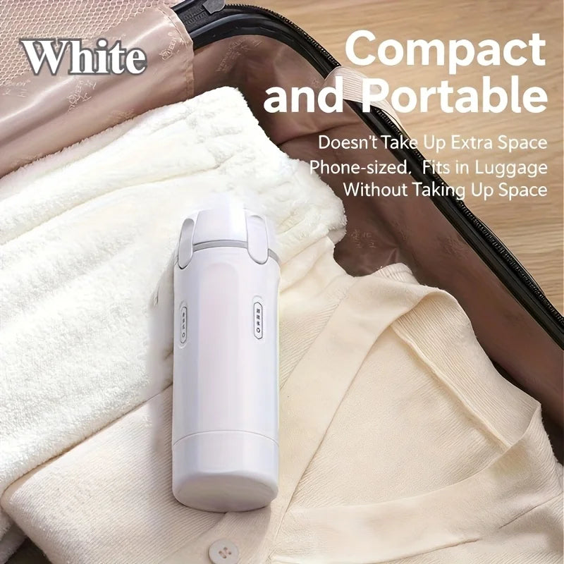 White handheld device on a suitcase with text highlighting its compact size.