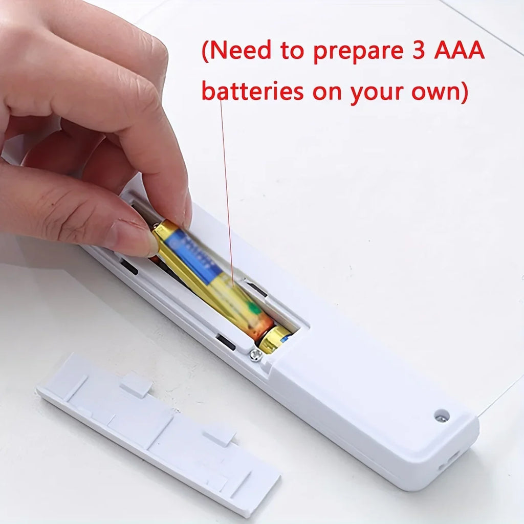 Hand inserting batteries into a device with text about AAA batteries needed.
